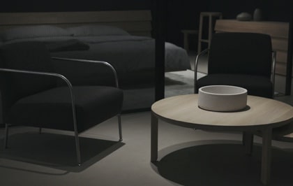 Dark modern furniture setup with black chairs and round table