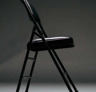 Modern black chair in minimalist setting